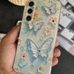 قاب موبایل سامسونگ گل بابونه و پروانه آبرنگی محافظ لنزدار