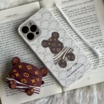 قاب موبایل آیفون خرس راه راه زبرا محافظ لنزدار + بند سیلیکونی