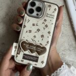 قاب موبایل آیفون گل چهارفصل فرگننت چرمی + استندقلبی