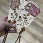 قاب موبایل ( آیفون - سامسونگ ) گل رز فلورا قهوه ای + بندست چرمی