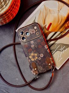قاب موبایل آیفون فلاور آیلیش قهوه ای به همراه بندست - تصویر 2